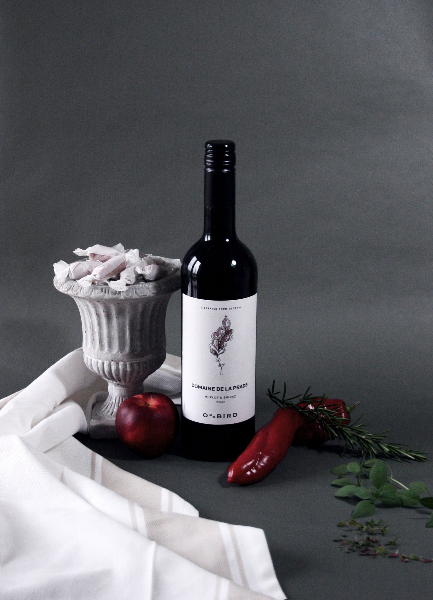 Wine bottle with decorative elements on a gray background