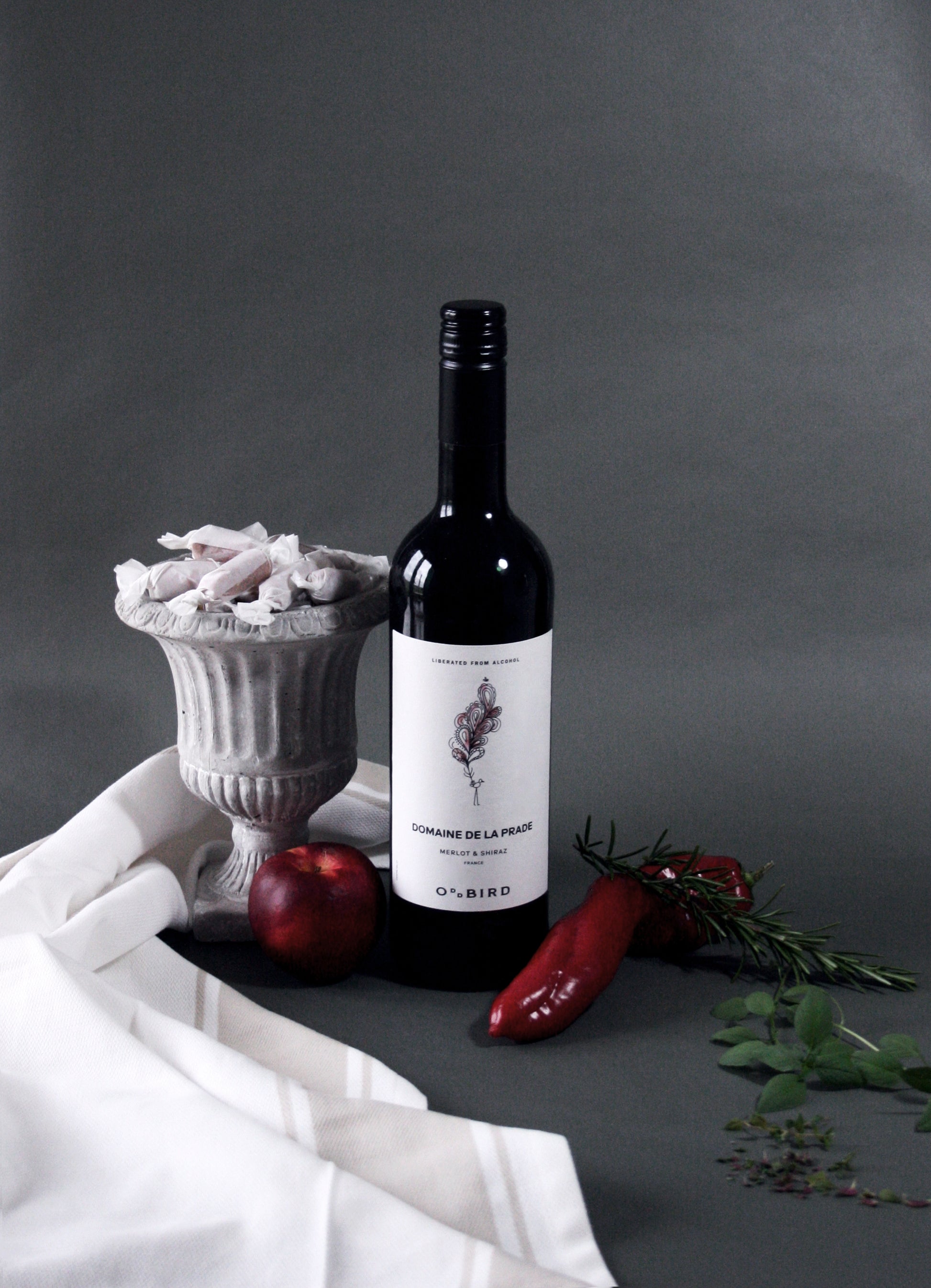 Wine bottle with decorative elements on a gray background