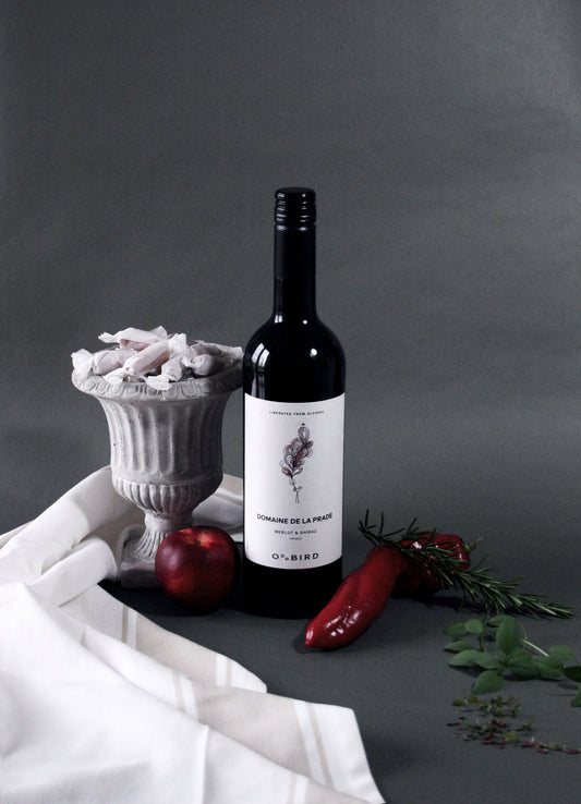 Wine bottle with decorative elements on a gray background